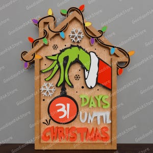 May include: Wooden Christmas countdown sign featuring a green hand, snowflakes, and colorful lights. The sign reads "31 Days Until Christmas" in orange and white lettering. A festive holiday decoration.