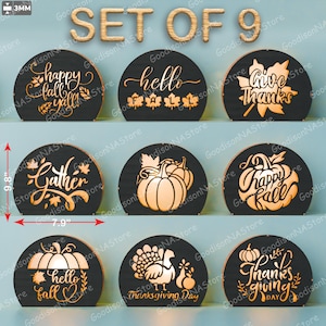 May include: A set of nine black wooden fall-themed decorations. Each piece is a semi-circle, approximately 9.8 inches tall and 7.9 inches wide, with laser-cut designs and text like "Happy Fall Y'all" and pumpkins. The text "SET OF 9" is at the top.