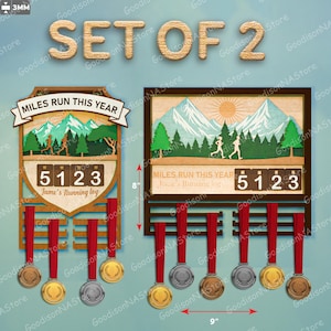 May include: A pair of wooden medal displays, each featuring a running theme. One is shield-shaped, the other rectangular, both with a counter showing "5123" and the text "Miles Run This Year". Each holder is 23 cm wide and 20 cm tall, with medals.