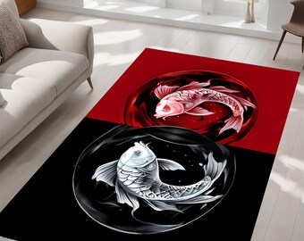 May include: A black and red rug with a yin yang design featuring two koi fish. The fish are in a circle, one red and one white, with black and white backgrounds.