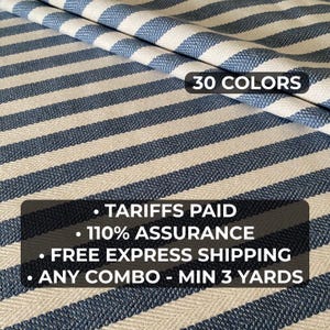 May include: Blue and white striped fabric with a herringbone weave. The fabric features a repeating pattern of navy blue stripes against a cream background. The text "30 COLORS" is visible. The image also includes text about tariffs, assurance, and shipping.