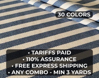 May include: Blue and white striped fabric with a herringbone weave. The fabric features a repeating pattern of navy blue stripes against a cream background. The text "30 COLORS" is visible. The image also includes text about tariffs, assurance, and shipping.