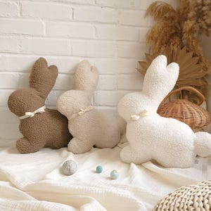Bunny pillow in neutral nursery decor, soft rabbit cushion for baby and toddler room