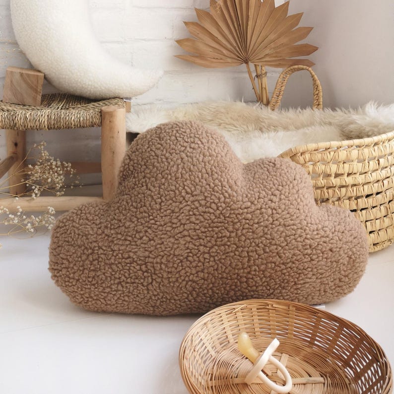 May include: A set of three ceramic mugs with a speckled, matte finish. The mugs are in shades of cream, light grey, and dark grey. Each mug has a simple, minimalist design, ideal for coffee or tea.