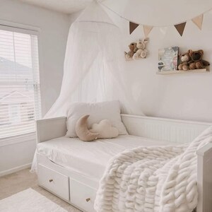May include: A distressed wooden sign, reading "Welcome to our home" in white lettering. The sign has a rustic finish, ideal for a front door or hallway, creating a welcoming atmosphere.