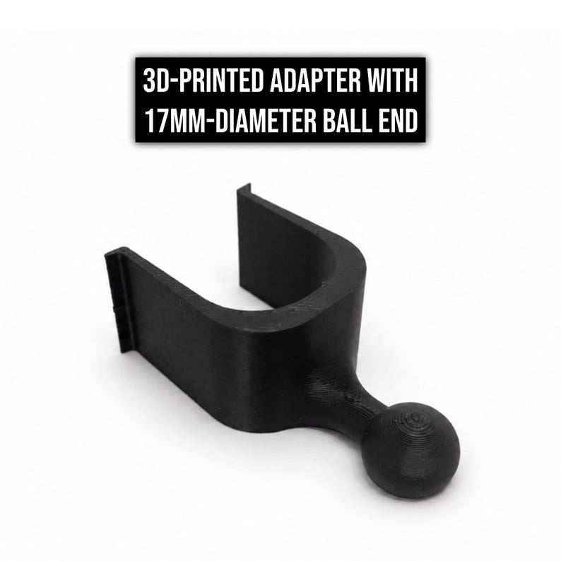 May include: A black 3D-printed adapter featuring a U-shaped clip and a 17mm-diameter ball end. The text 3D-PRINTED ADAPTER WITH 17MM-DIAMETER BALL END is displayed above the object, which is constructed from a matte material with visible layers.