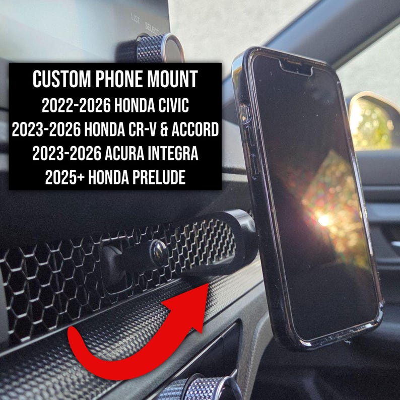 May include: A black custom phone mount attached to a vehicle dashboard with a honeycomb pattern. The text reads: CUSTOM PHONE MOUNT 2022-2026 HONDA CIVIC 2023-2026 HONDA CR-V & ACCORD 2023-2026 ACURA INTEGRA 2025+ HONDA PRELUDE. A smartphone is mounted.