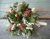 Bridal bouquet made with fresh evergreens and pine cones with birch handle. For your winter woodland natural wedding.