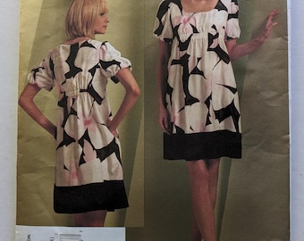 DKNY Vogue Sewing Pattern V1103 Abito pullover sopra il ginocchio a trapezio con sottoveste 8-14 non tagliato