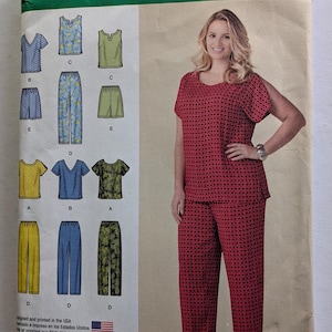 May include: Simplicity sewing pattern number 1446 FF for sizes 16W-24W, 44-50 Euro, and 46-52 French. The pattern includes instructions for making six different tops and pants. The pattern shows a woman wearing a red top and pants with a black and white polka dot pattern.