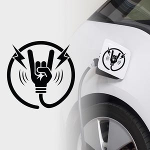 May include: Black and white graphic of a hand making the rock and roll gesture, with lightning bolts and sound waves. The design is on a white car charging port cover and a separate sticker.