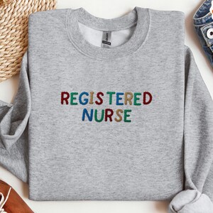 Registered nurse embroidered Sweatshirt, Nurse appreciation gift,Nurse Pullover Sweatshirt,Gift for Grad,New Nurse Gift,Nursing School Shirt