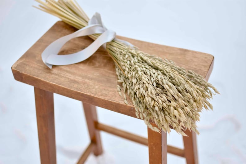 Dried oat bouquet tied with satin ribbon.