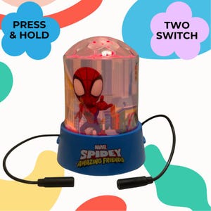 May include: A Spidey and His Amazing Friends night light with a blue base and a clear, dome-shaped top. The light features a cartoon image of Spiderman. The base has the text "Marvel Spidey and His Amazing Friends". The words "Press & Hold" and "Two Switch" are also visible.