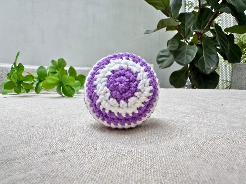 Purple spiral crochet hacky sack pattern, white and purple swirl amigurumi footbag, beginner fidget toy PDF tutorial