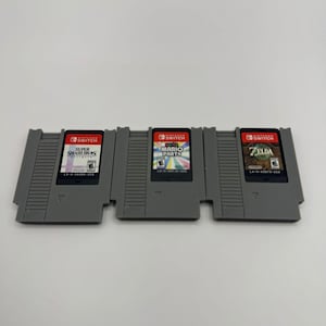 Switch 1 & 2 ゲーム用の NES カートリッジ ディスプレイ。(スタンド付属)