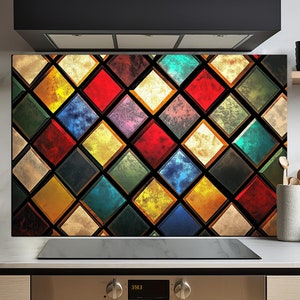 May include: A colorful kitchen backsplash with a stained glass design featuring a pattern of diamond shapes in various shades of red, blue, green, yellow, and gold.