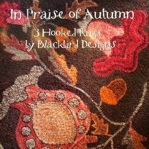 May include: A close-up of a hooked rug with the text "In Praise of Autumn" and "3 Hooked Rugs by Blackbird Designs". The rug features a floral design in shades of red, orange, and brown on a dark background. The names "Barl Adams & Alma Allen" are also visible.