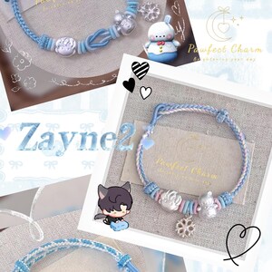 May include: Light blue and white braided bracelets with decorative silver charms. The bracelets feature a variety of designs, including floral and character-shaped charms. The image also includes the text "Zayne" and "Pawfect Charm".