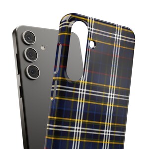 May include: A black phone case with a blue, white, and yellow plaid pattern.
