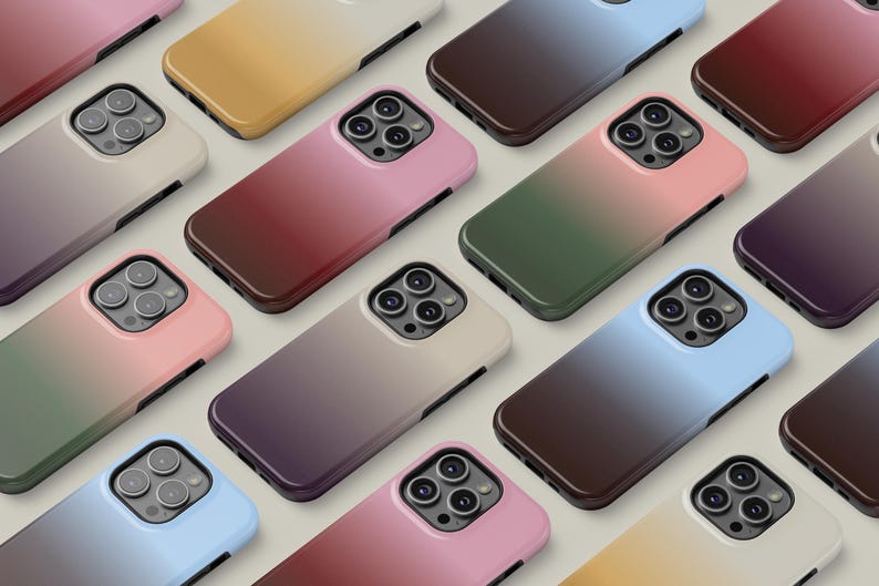 May include: A collection of smartphone cases in various colors, including pink, green, blue, and brown. Each case features a gradient design and a camera cutout. The cases are arranged in a grid pattern.