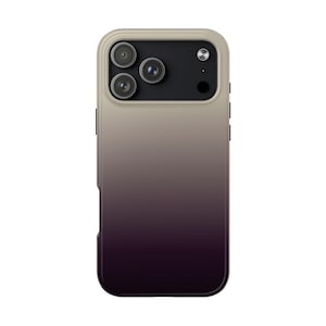 May include: A smartphone case with a gradient design, transitioning from a light beige at the top to a deep purple at the bottom. The case features a camera module with three lenses and a flash.