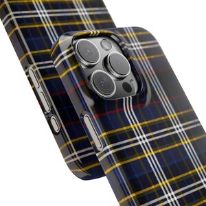 May include: A black phone case with a blue, yellow, and white plaid pattern. The case has a raised camera bump with a black camera lens.