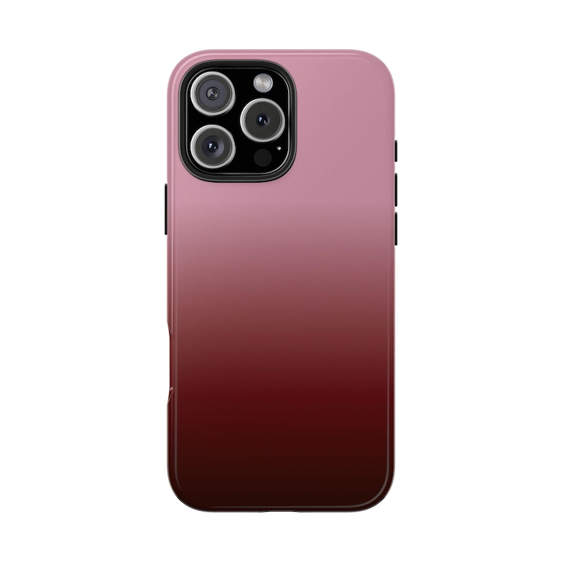 May include: A gradient phone case in shades of pink and burgundy. The case has a glossy finish and a camera cutout with multiple lenses. The design transitions from light pink at the top to a deep burgundy at the bottom.