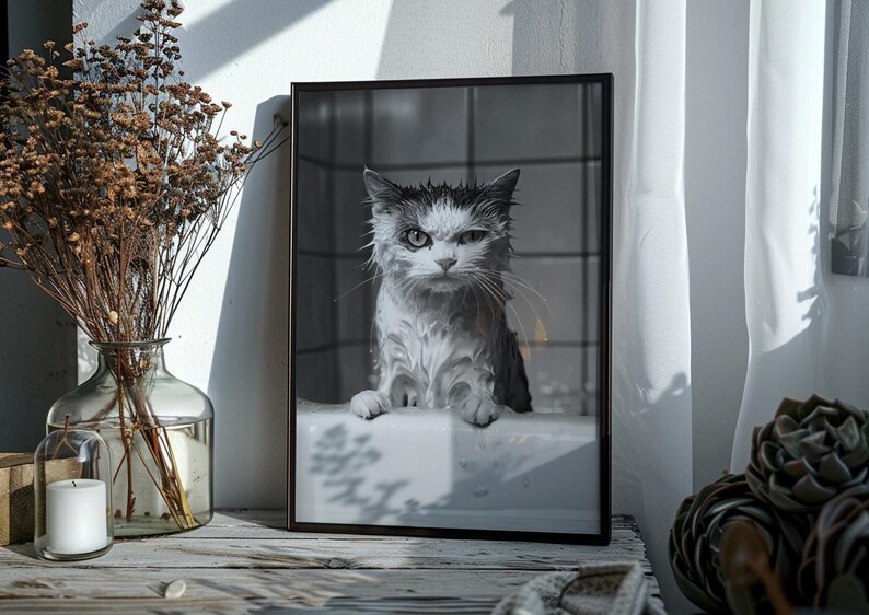 A black and white photo of an angry-looking wet cat climbing out of a bath