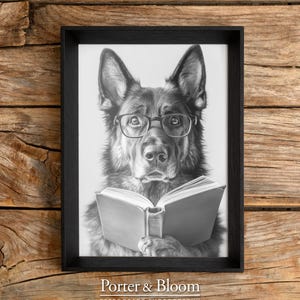 black and white photo of a german shepherd wearing glasses reading a book