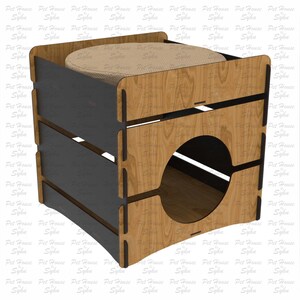 Puede incluir: Una casa para gatos de madera con una entrada redonda y una parte superior acolchada. La estructura es de madera marr&oacute;n claro con detalles en gris oscuro. El texto "Laser Cut File" es visible en el lado derecho.