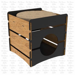 Puede incluir: Una casa para gatos de madera con marco negro y coj&iacute;n beige. La casa para gatos tiene una abertura circular y est&aacute; hecha de madera en capas. El dise&ntilde;o es adecuado para corte por l&aacute;ser. El texto "Laser Cut File" es visible.