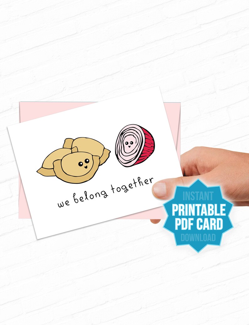 May include: Printable card with a cartoon illustration of a dumpling and an onion with the text "we belong together". The card has a pink background and a blue starburst with the text "Instant Printable PDF Card Download".