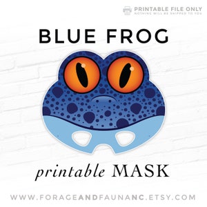 May include: Printable blue frog mask with orange eyes and a white background. The text "BLUE FROG" is above the mask and "printable MASK" is below the mask. The text "WWW.FORAGEANDFAUNANC.ETSY.COM" is at the bottom of the image.