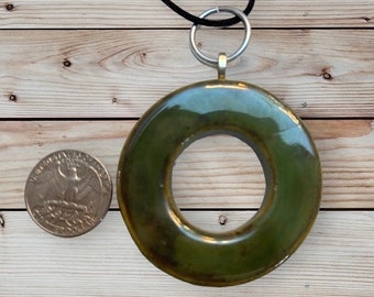 Whimsical Ceramic green circle necklace pendant, earth inspired, clay jewelry, fashion accessories, kiln fired