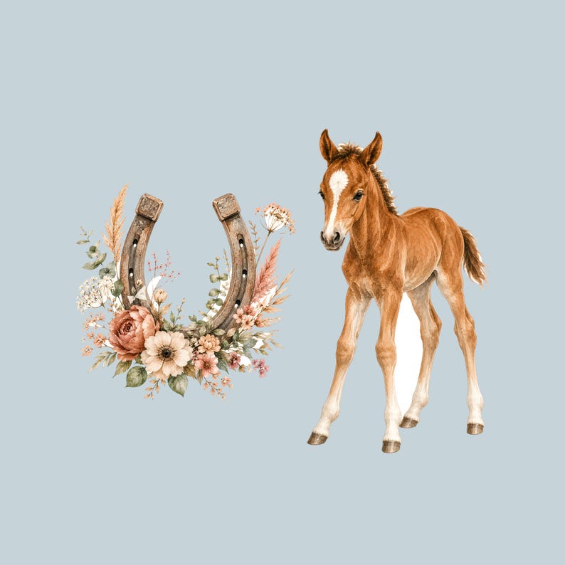 May include: A brown foal with a white blaze on its forehead standing next to a metal horseshoe decorated with a cluster of peach, cream, and brown flowers, dried grasses, and green leaves against a solid light blue background.