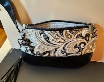 Black Leather Clutch Featuring Black, Gold, and Cream Paisley Fabric. Removable Tassel.