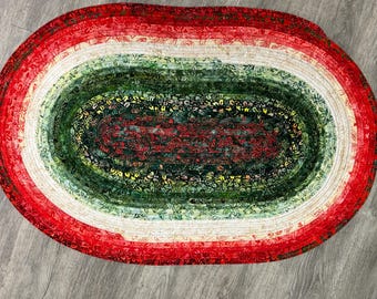 Christmas-Themed Handmade Quilted Rug: Cotton Batik Featuring Red, Green, and Cream.