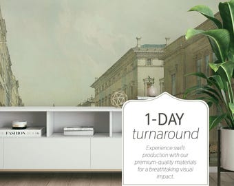 Può includere: Un mobile TV bianco moderno con un murale di paesaggio urbano sullo sfondo. Il mobile contiene libri e oggetti decorativi. Una grande pianta in vaso è sulla destra. Il testo "1-DAY turnaround" è incluso.