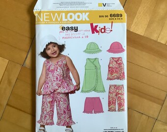 New Look 6689 Paper Pattern, Toddler Ruffled Mock Wrap Dress Top Hat Pants Shorts, Child Summer Outfit, New, UNCUT, Size A(1/2-1-2-3-4) 2007