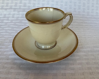 Vintage Gold Trimmed Ivory Teacup and Saucer Set