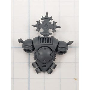 May include: A gray plastic miniature figure torso with a spiked crown, shoulder pads, and a chest plate. The figure has a detailed design with vents and geometric shapes, likely for a tabletop game or hobby project.