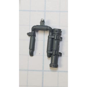 May include: A gray plastic model kit piece for a sci-fi miniature. The piece is shaped like a backpack with two cylindrical containers and straps.