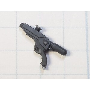May include: A gray plastic toy gun with a black barrel and a trigger. The gun has a futuristic design with a handle and a scope.