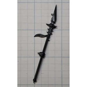 May include: A black spear with a pointed blade and ornate details. The spear features a series of spikes and a decorative leaf-like element. The spear is designed with a detailed handle and a pointed tip.