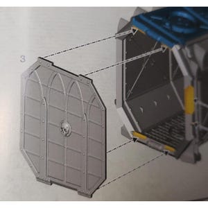 May include: A detailed diagram showing how to assemble a model kit. The diagram shows a gray metal door with a skull design and a blue and gray compartment with a yellow stripe.