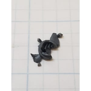 May include: A gray plastic model of a spaceship or vehicle with a detailed design. The model is made up of several pieces that fit together.