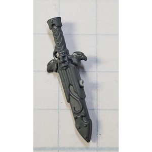 May include: A gray plastic sword with intricate details and a bird design on the hilt.