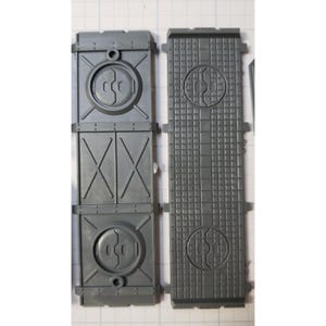 May include: Two gray plastic panels with a textured surface and a circular design. The panels are designed for a model kit.
