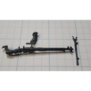 May include: A set of three gray plastic model pieces for a miniature wargame. The pieces include a long gun barrel, a smaller gun barrel, and a separate piece that appears to be a hand.